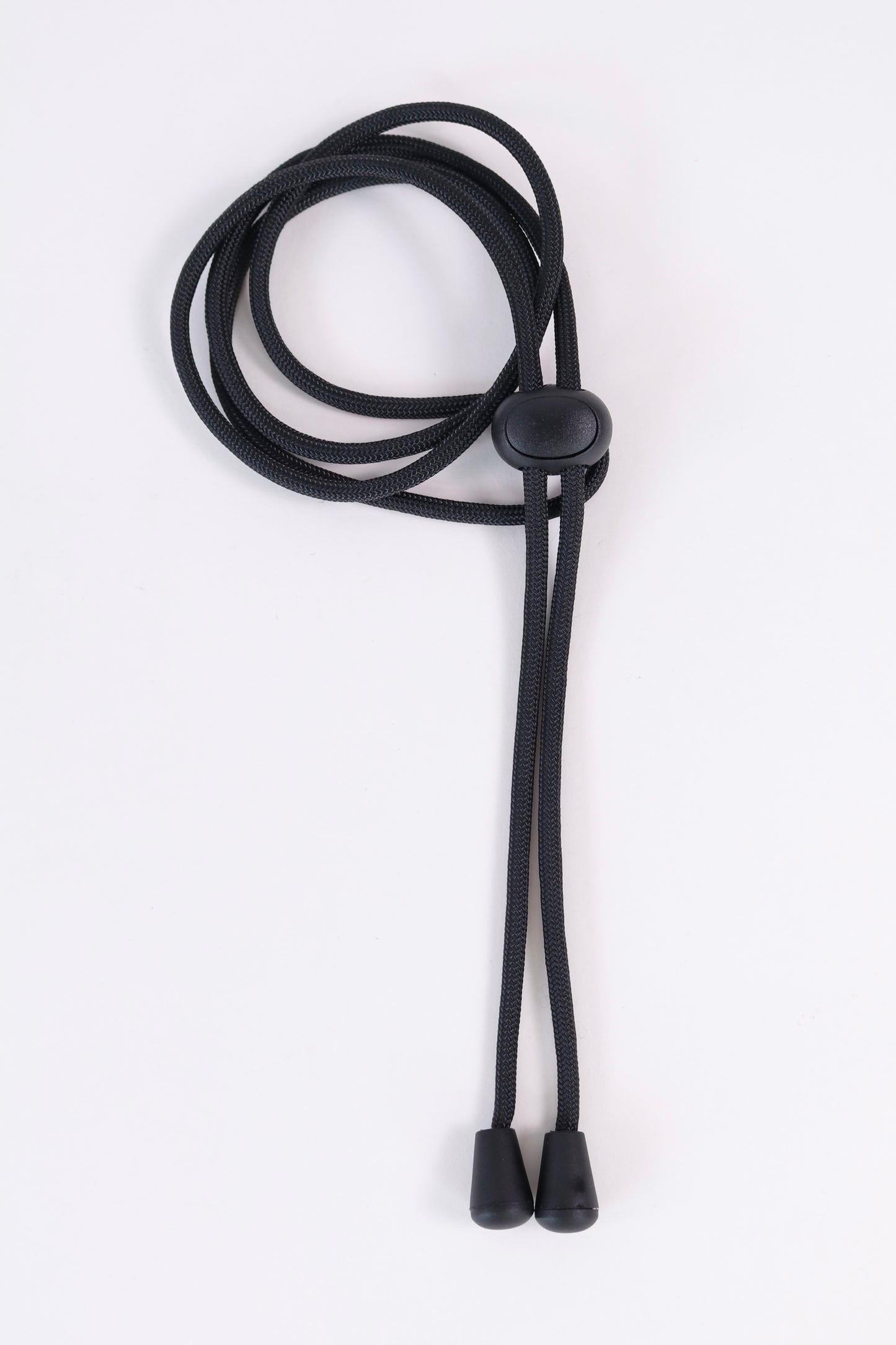 Black lanyard with a button on a white background