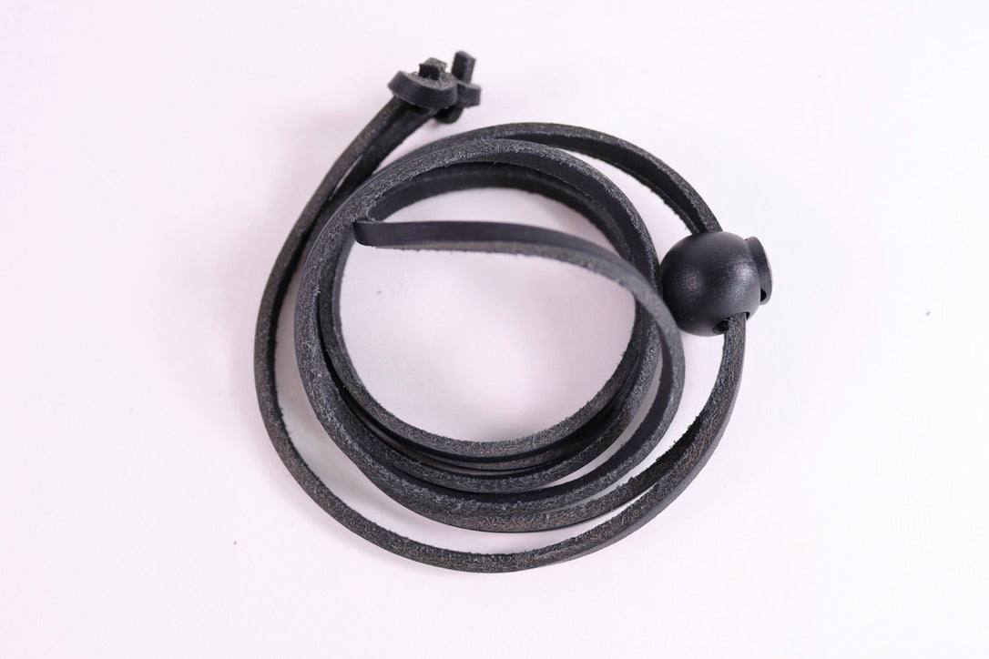 Black leather strap on a white background