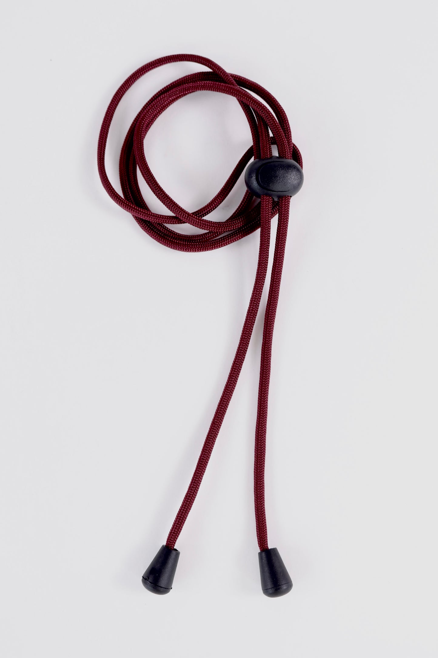 Red lanyard with black ends on a white background