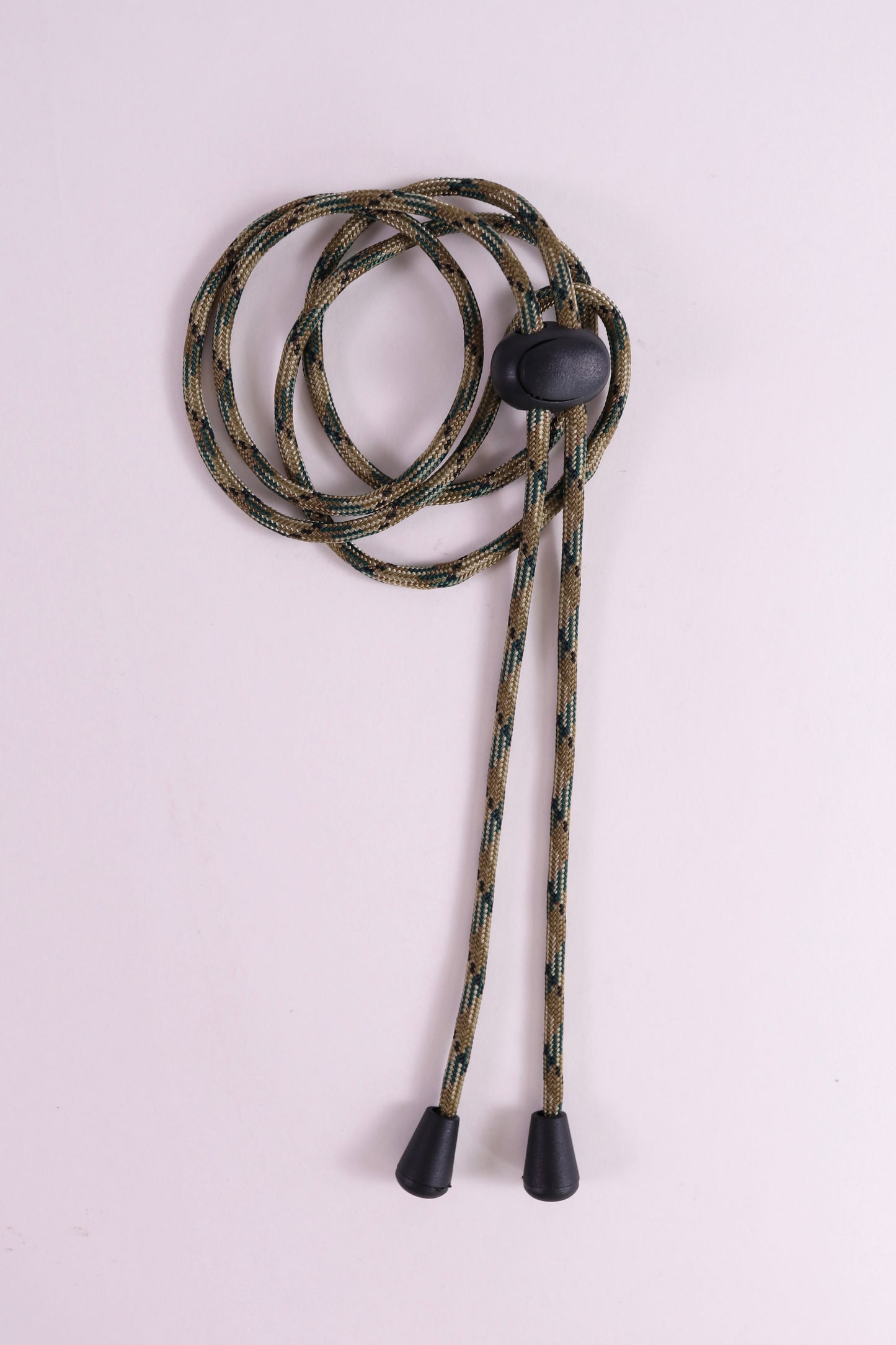 Camouflage lanyard with black ends on a light gray background