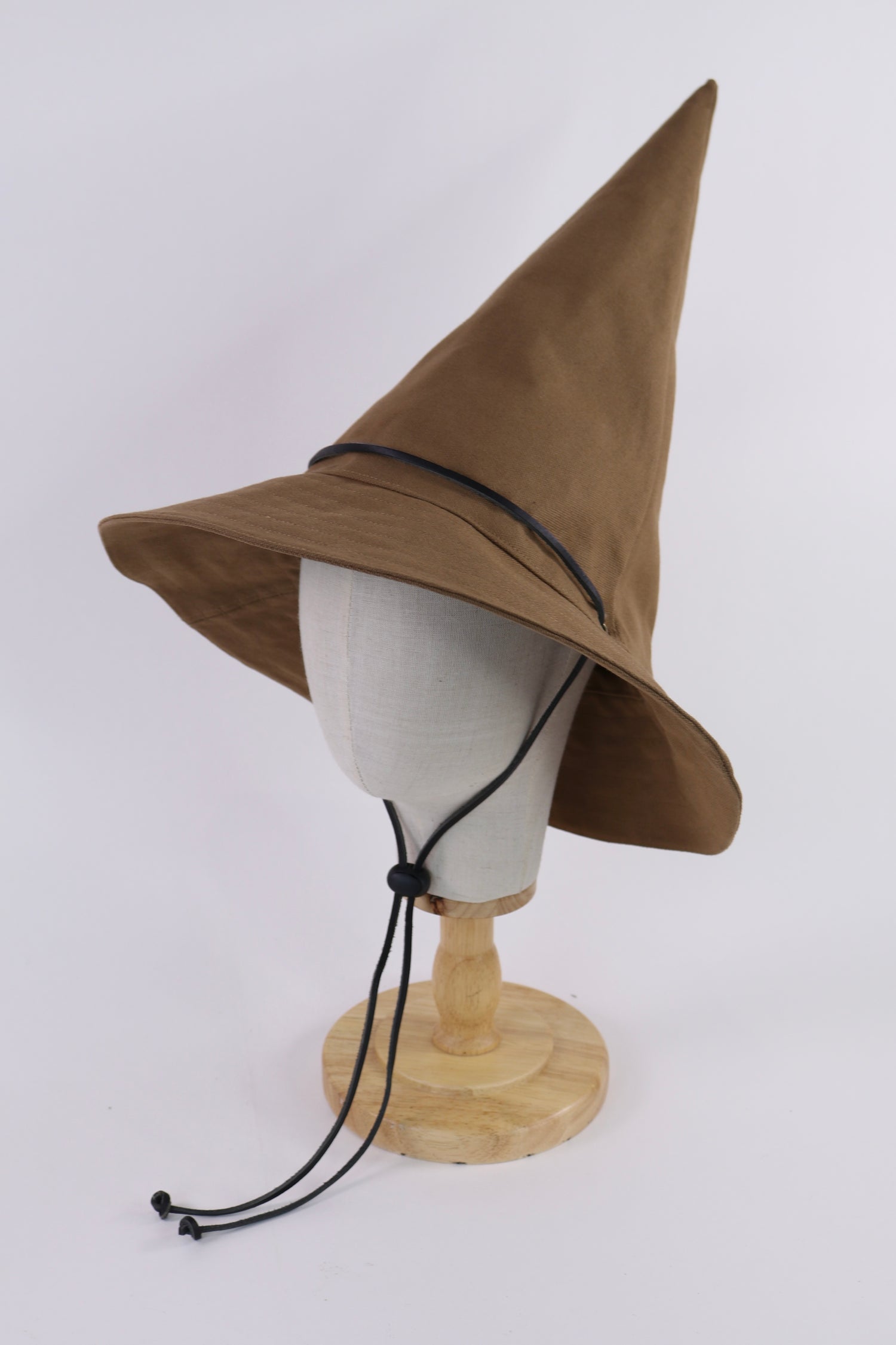 Dark Khaki Brown pointed wizard hat with a black chin strap on a mannequin head against a white background