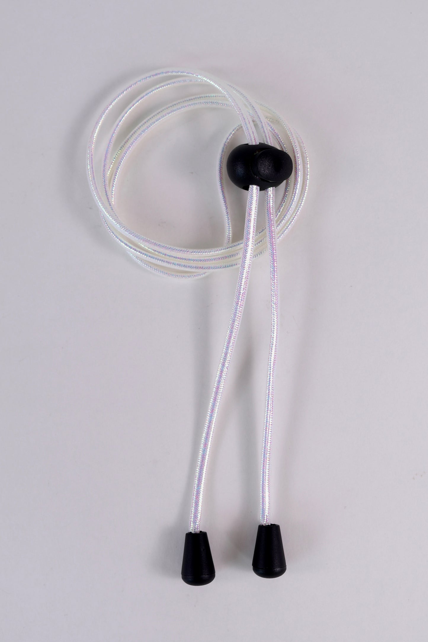 Clear tube with black ends on a light gray background
