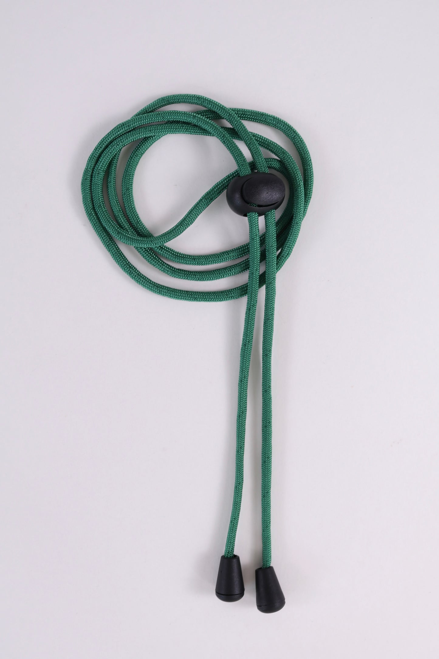Green lanyard with black ends on a white background