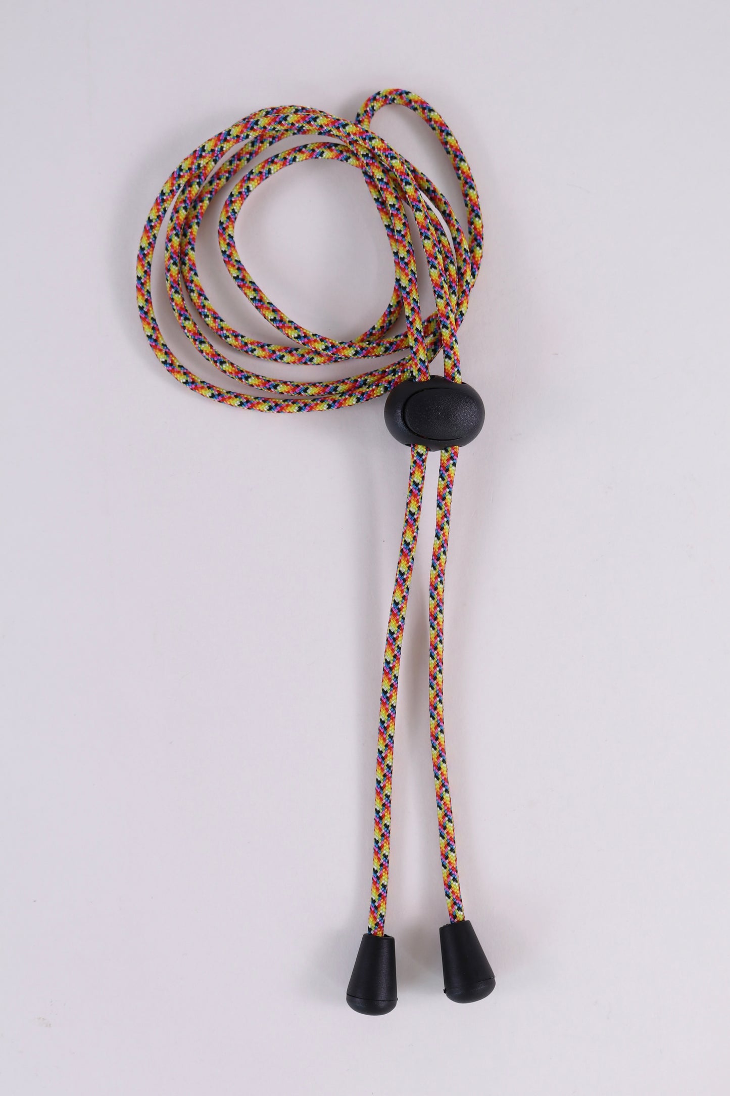 Multicolored lanyard with black ends on a white background
