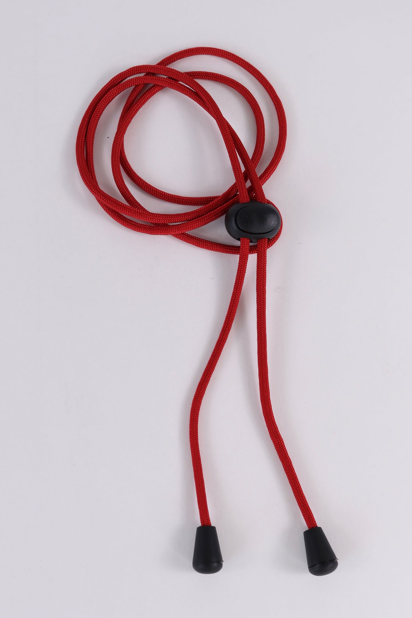 Red lanyard with black ends and button on a white background