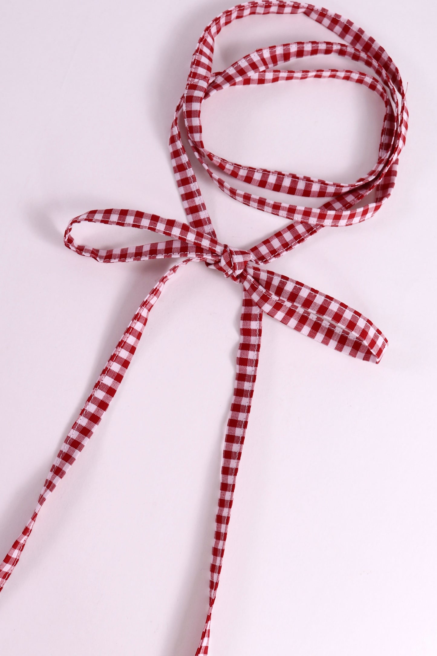 Red and white checkered cotton tie.